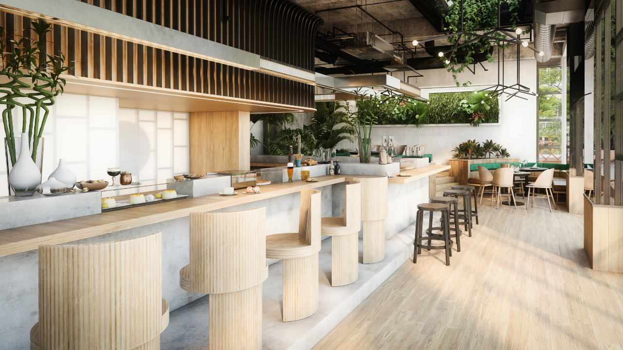 Interior de una cafetería con mesas de trabajo